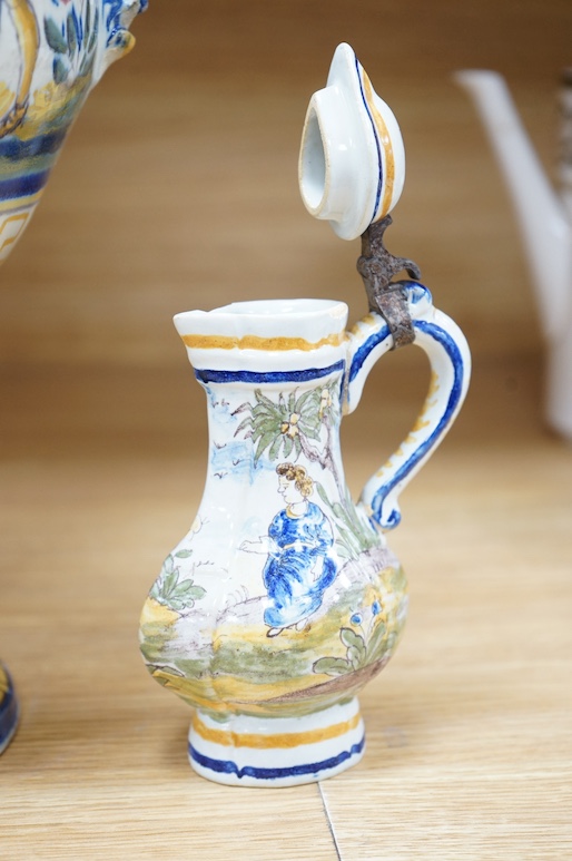 A 19th century faience lidded vase and a later small jug, tallest 49cm. Condition - poor to fair